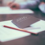 Open notebook with pencil on top